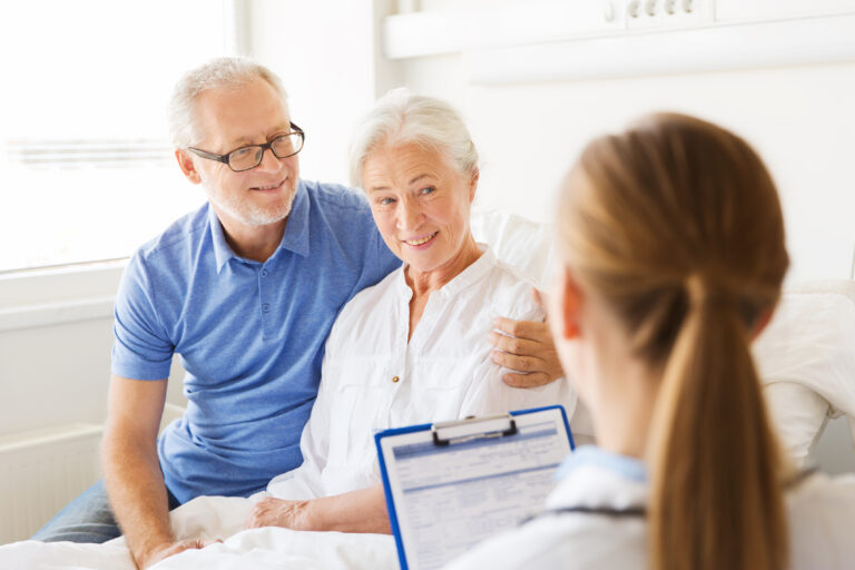 older couple with doctor participating in clinical trial